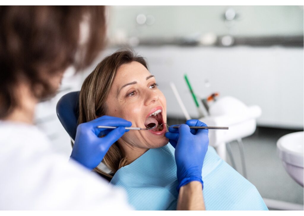Patient receiving a cosmetic dental evaluation to help choose between bonding or veneers